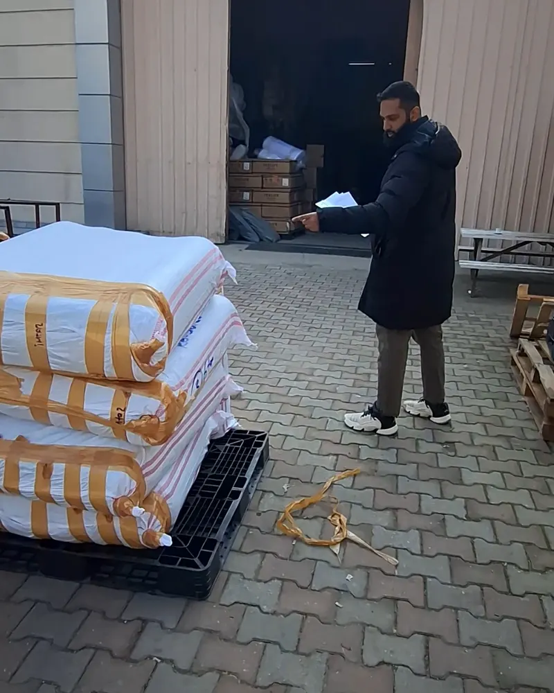 Katfusion team member inspecting palletised cargo before dispatch